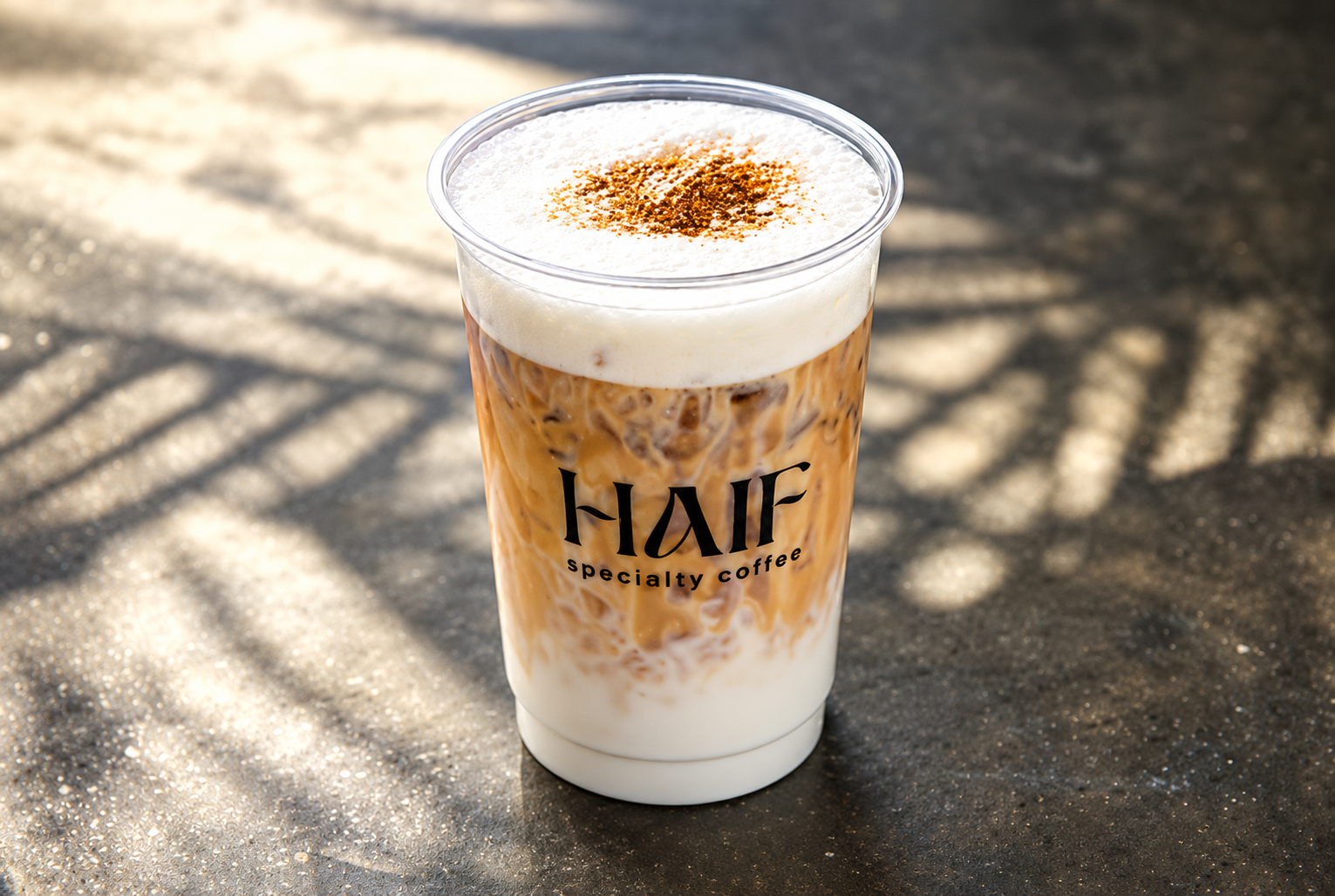 Haif iced coffee in its branded cup